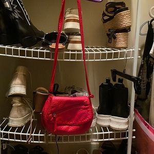 Red “under one sky” crossbody small purse. Excellent condition. Only used once